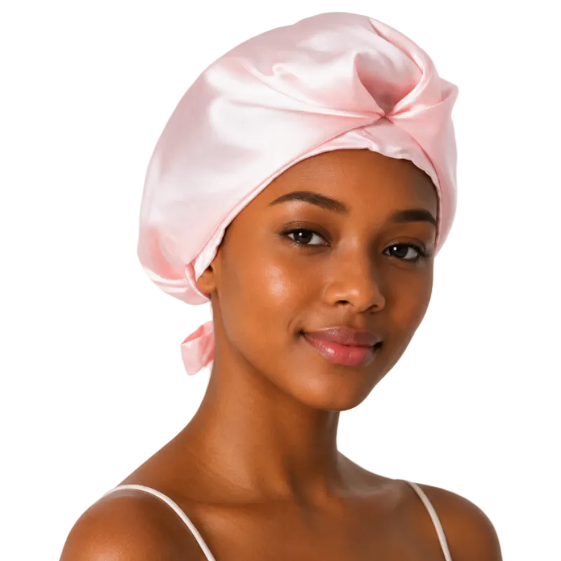 Woman wearing a pink satin headscarf on a white background