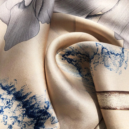 Close-up of beige fabric with blue and brown abstract patterns